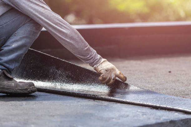 Professional Waterproofing technician working in Holtsville, NY